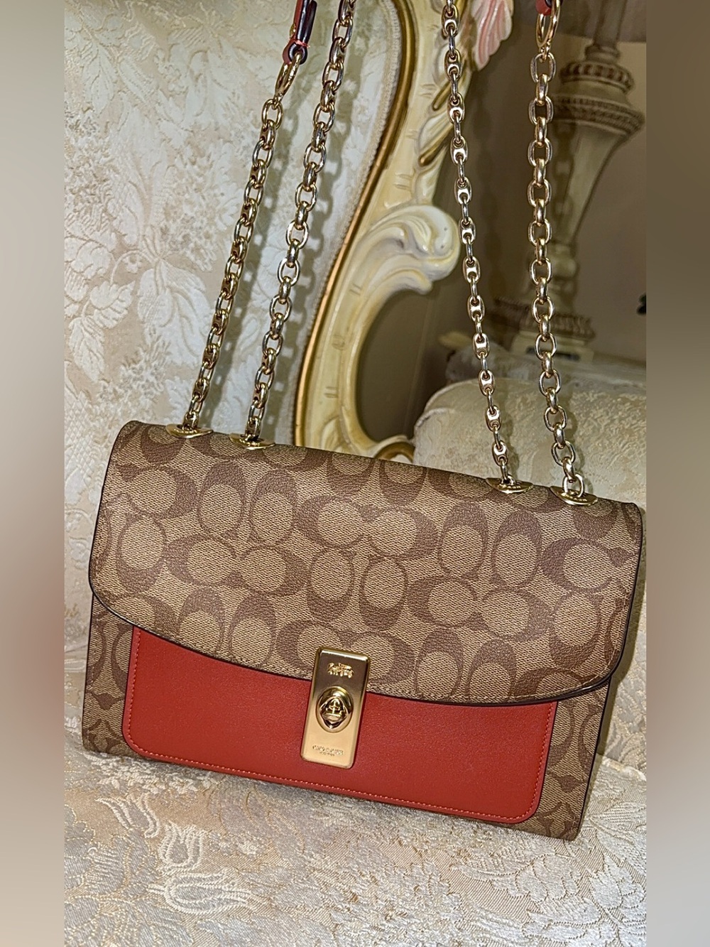 Coach Brown Signature Canvas Shoulder Bag with Red Accent